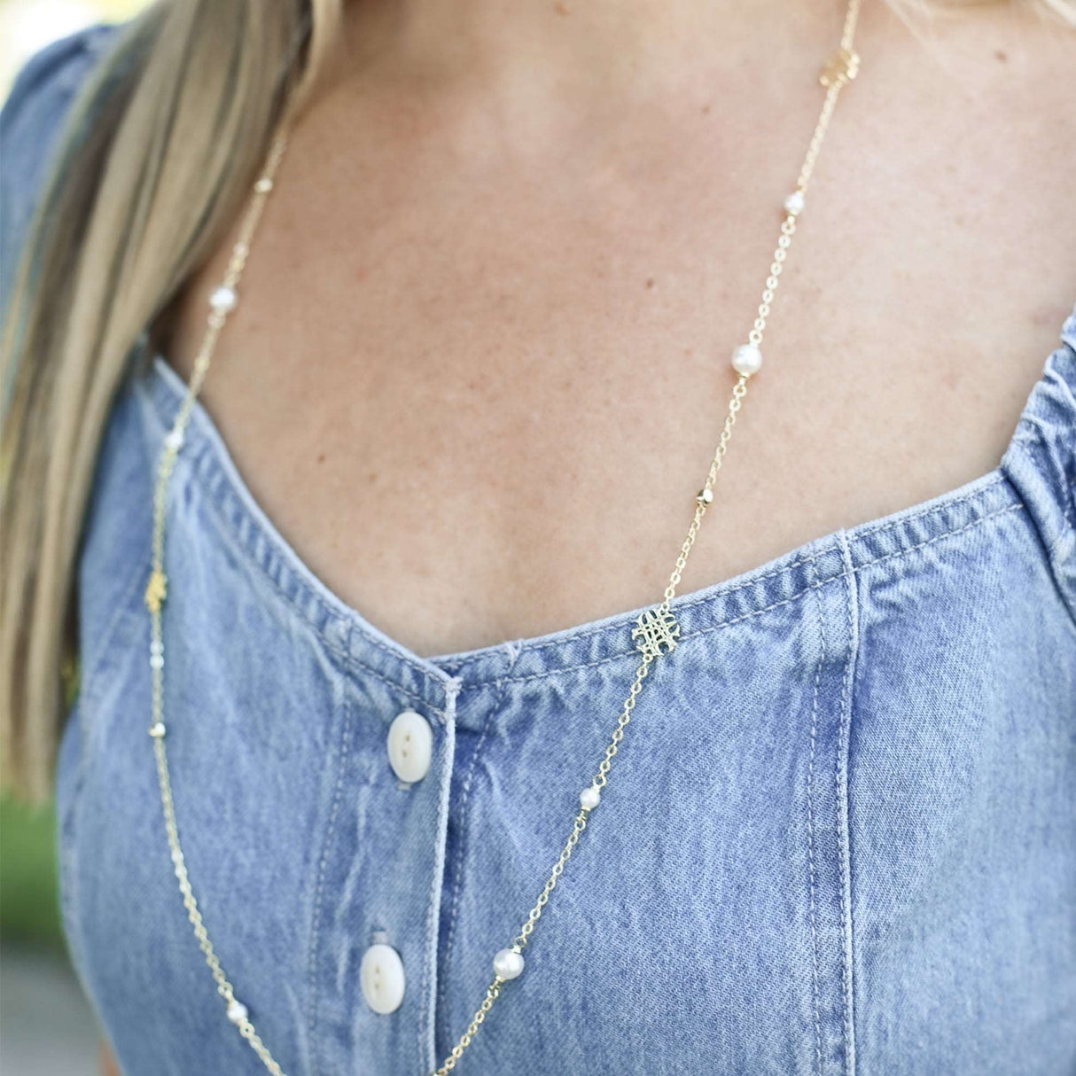 Adorned Pearl Logo Station Necklace in Gold
